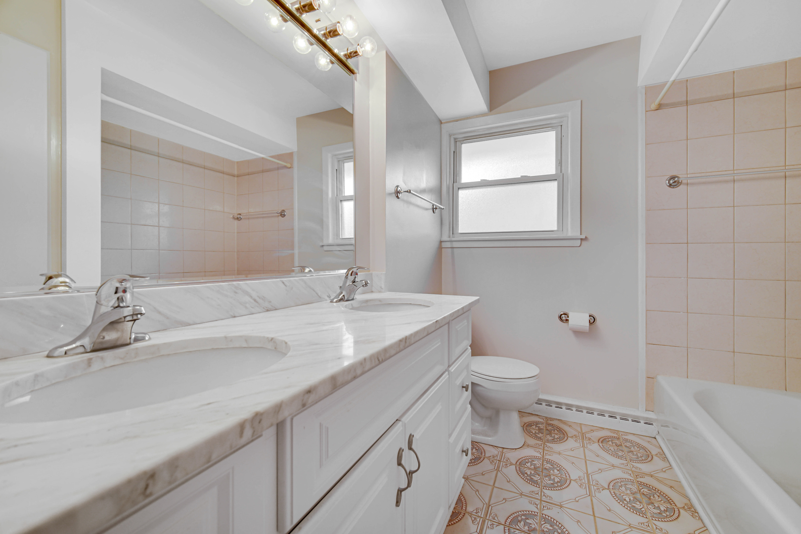 2224 Parkside Drive Park Ridge, IL 60068 - Photo 14 of 26 a bathroom with a granite countertop sink a toilet and a bathtub