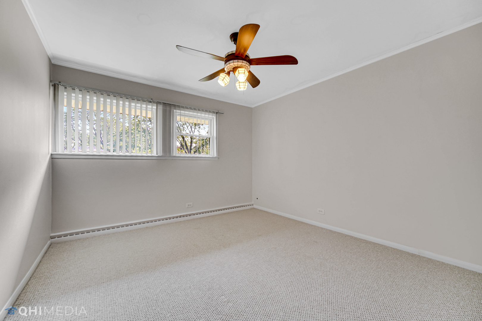 2224 Parkside Drive Park Ridge, IL 60068 - Photo 16 of 26 an empty room with windows and fan
