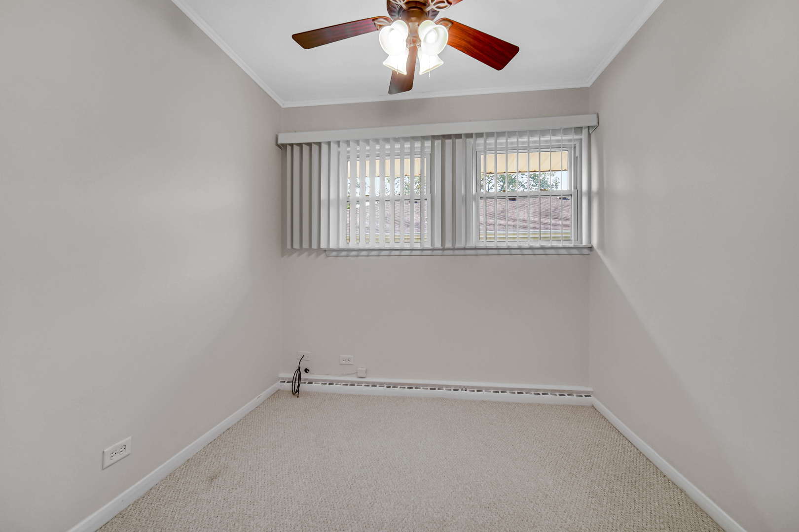 2224 Parkside Drive Park Ridge, IL 60068 - Photo 19 of 26 an empty room with windows and fan