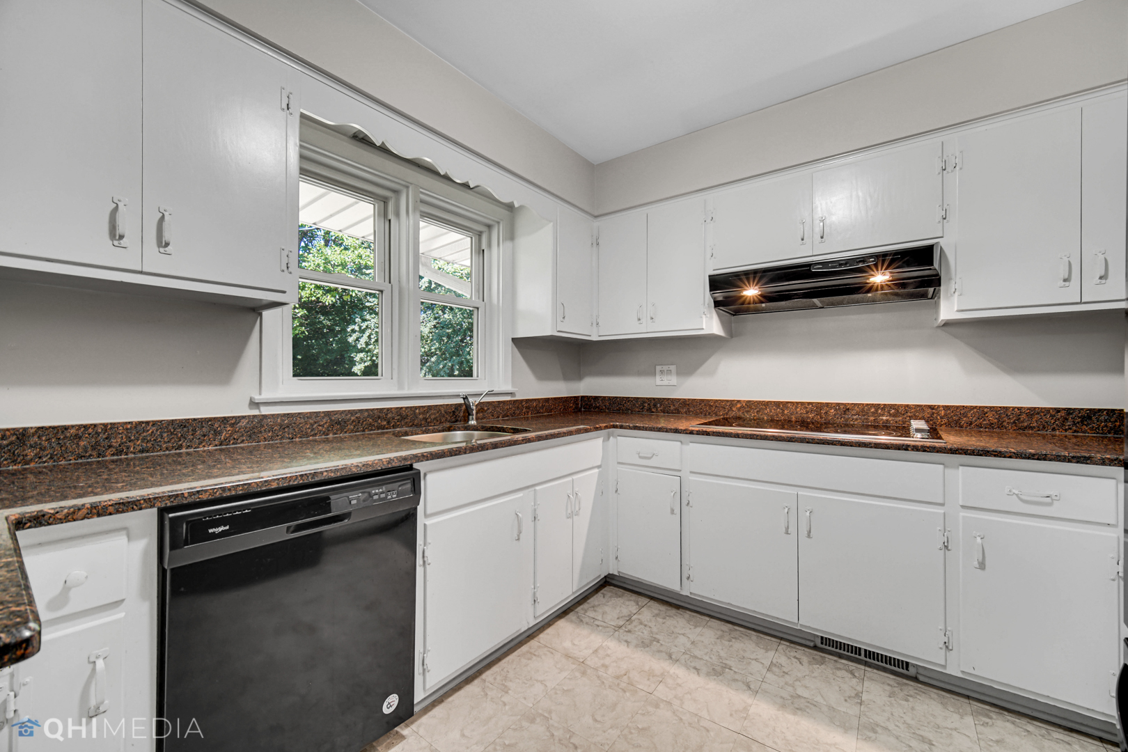 2224 Parkside Drive Park Ridge, IL 60068 - Photo 4 of 26 a kitchen with granite countertop a sink stainless steel appliances and white cabinets