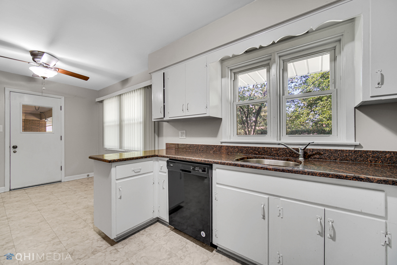 2224 Parkside Drive Park Ridge, IL 60068 - Photo 5 of 26 a kitchen with granite countertop stainless steel appliances white cabinets and a window
