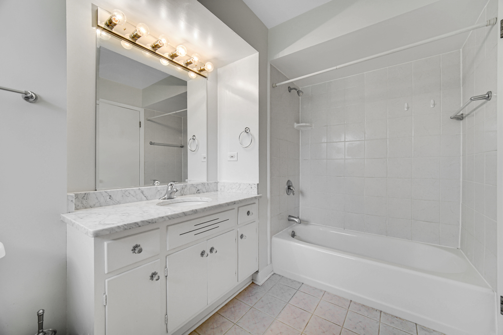 2224 Parkside Drive Park Ridge, IL 60068 - Photo 10 of 26 a spacious bathroom with a granite countertop sink mirror toilet and bathtub