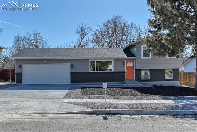 1913 Wooten Road Colorado Springs, CO 80915 - Photo 2 of 50 Tri-level home with a garage