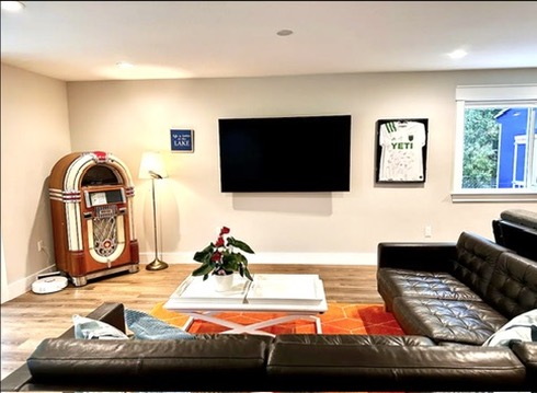 2007 Manana Street Austin, TX 78730 - Photo 12 of 38 Living area with wood finished floors and recessed lighting