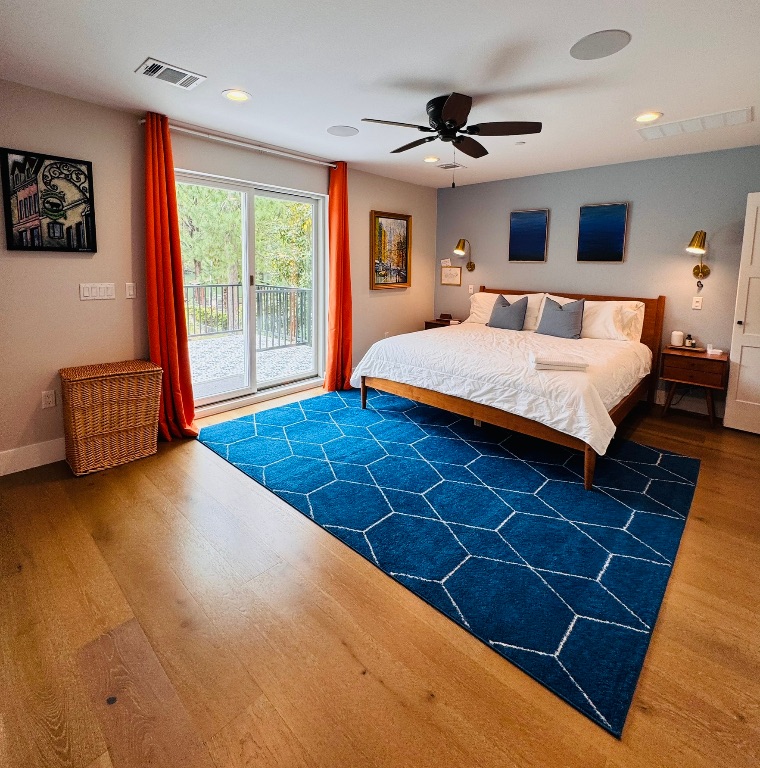 2007 Manana Street Austin, TX 78730 - Photo 22 of 38 Bedroom with access to exterior, dark wood-style flooring, a ceiling fan, and recessed lighting