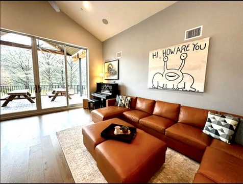 2007 Manana Street Austin, TX 78730 - Photo 26 of 38 Living room featuring light wood finished floors, lofted ceiling, and a sunroom