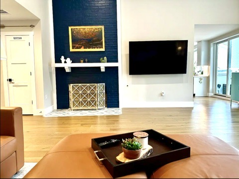 2007 Manana Street Austin, TX 78730 - Photo 29 of 38 Living area with wood finished floors and baseboards