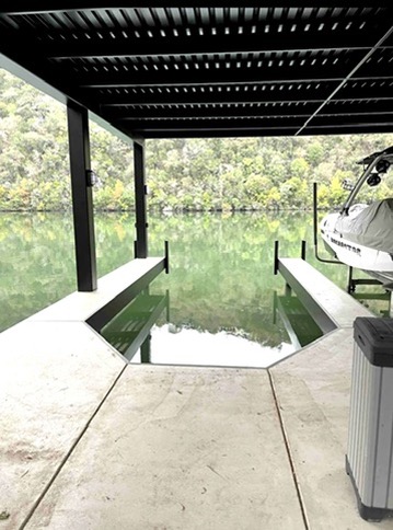 2007 Manana Street Austin, TX 78730 - Photo 7 of 38 Dock with a water view, boat lift, and a pergola