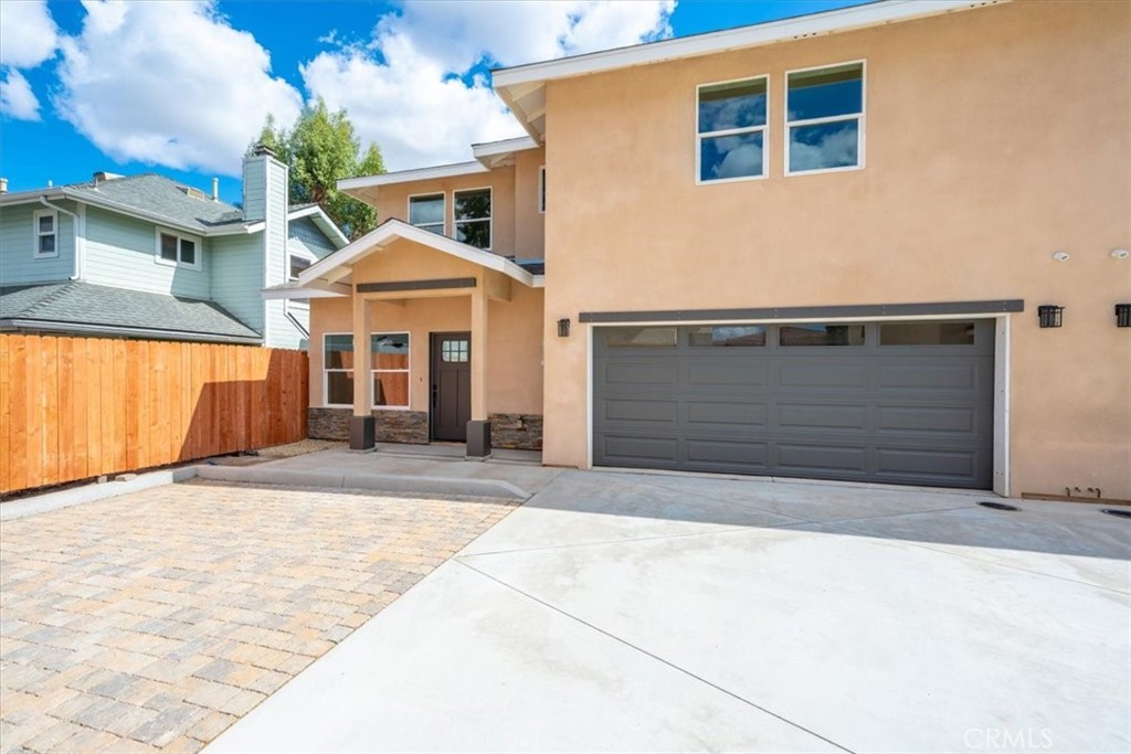 a front view of a house with a garage