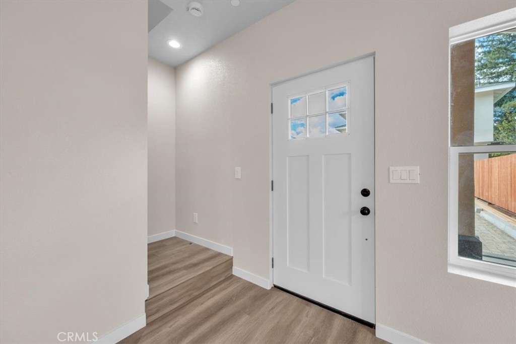 8393 Amapoa Atascadero, CA 93422 - Photo 12 of 23 a view of entryway with window and wooden floor