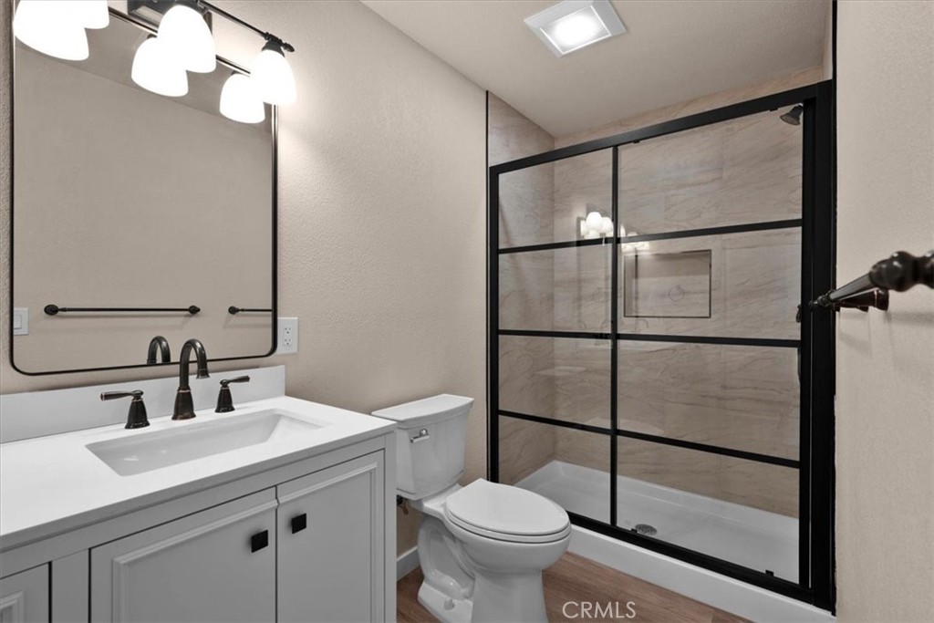 8393 Amapoa Atascadero, CA 93422 - Photo 15 of 23 a bathroom with a toilet sink and mirror