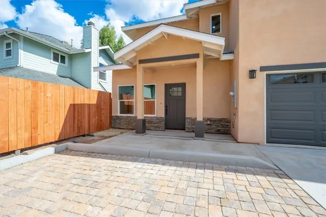 a view of a house with a snow on the road
