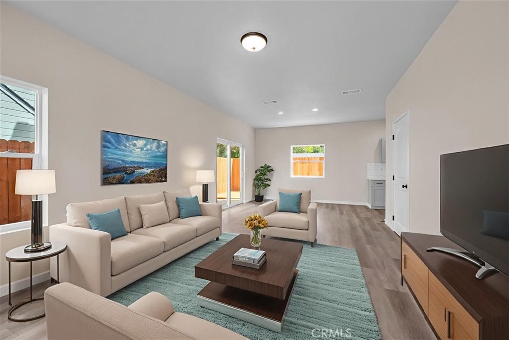 8393 Amapoa Atascadero, CA 93422 - Photo 5 of 23 a living room with furniture and a flat screen tv