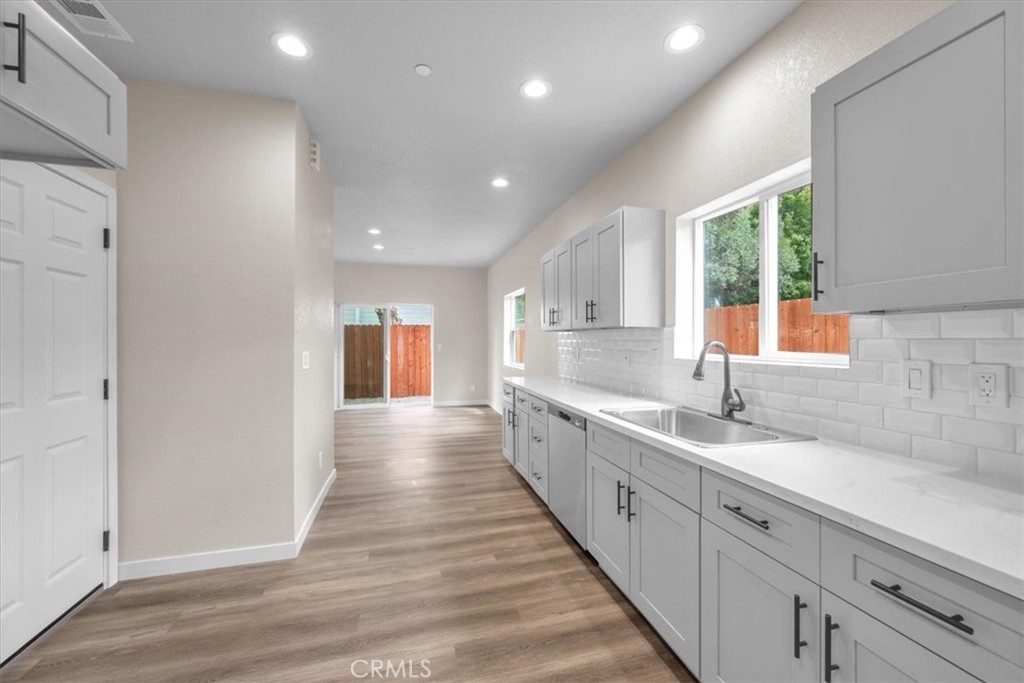 8393 Amapoa Atascadero, CA 93422 - Photo 9 of 23 a large white kitchen with a sink and dish washer