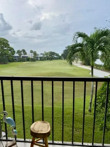 a view of a balcony with lake view and mountain view