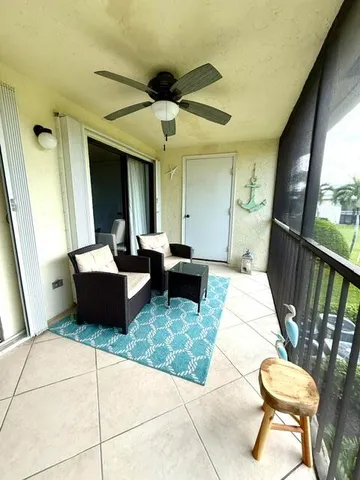 a living room with a couch and a rug