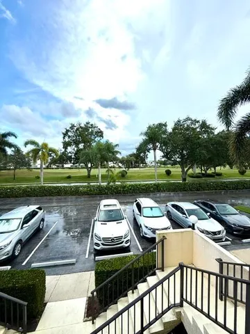a view of a wooden deck with lake view