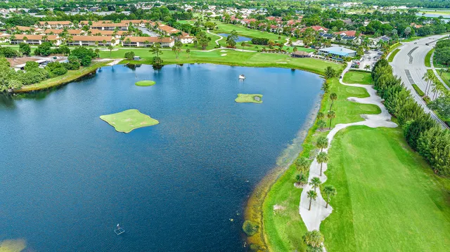 an aerial view of a house with a swimming pool yard and outdoor seating