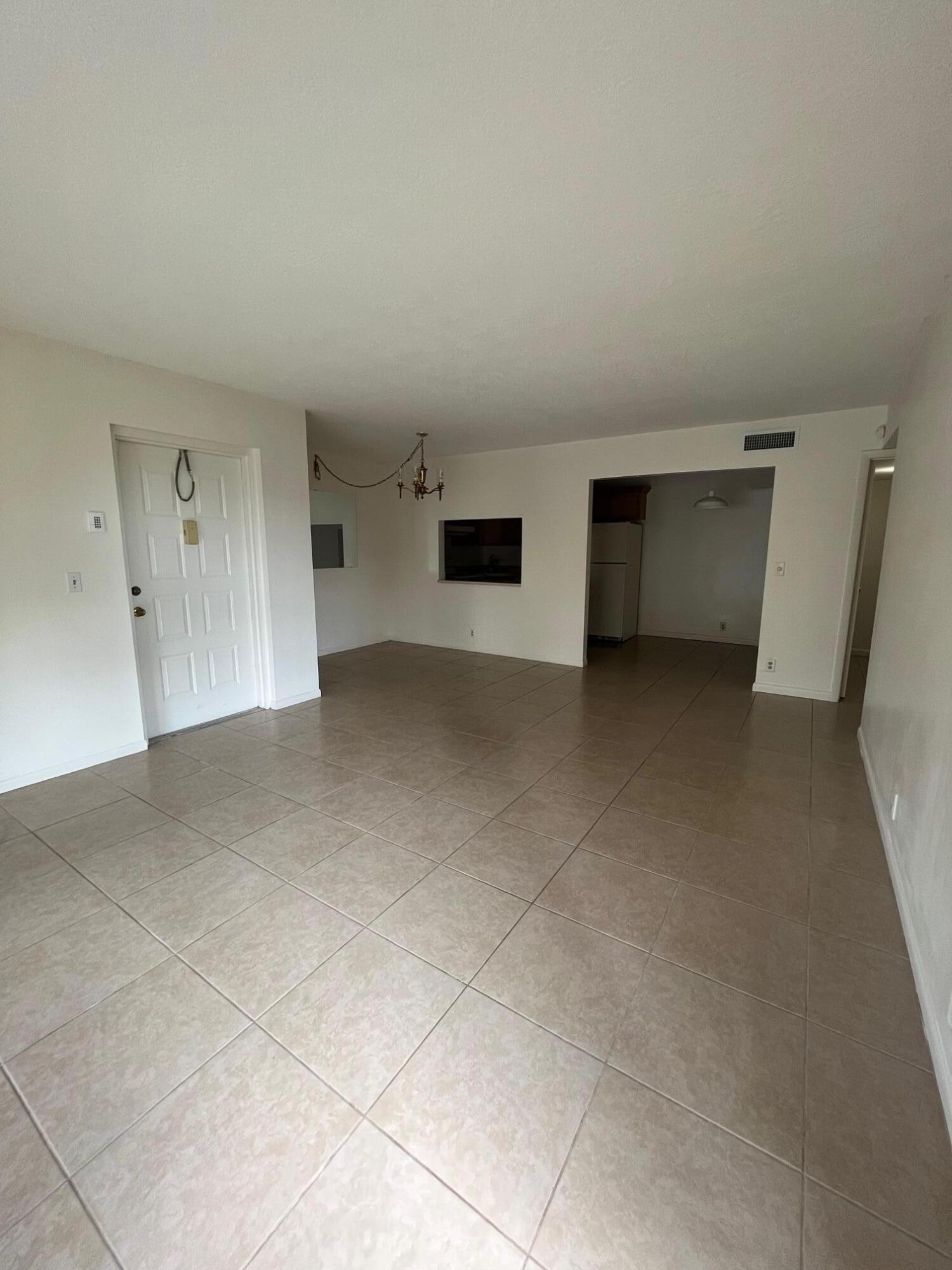 801 Sky Pine Way, Unit B1 Greenacres, FL 33415 - Photo 3 of 17 a view of empty room