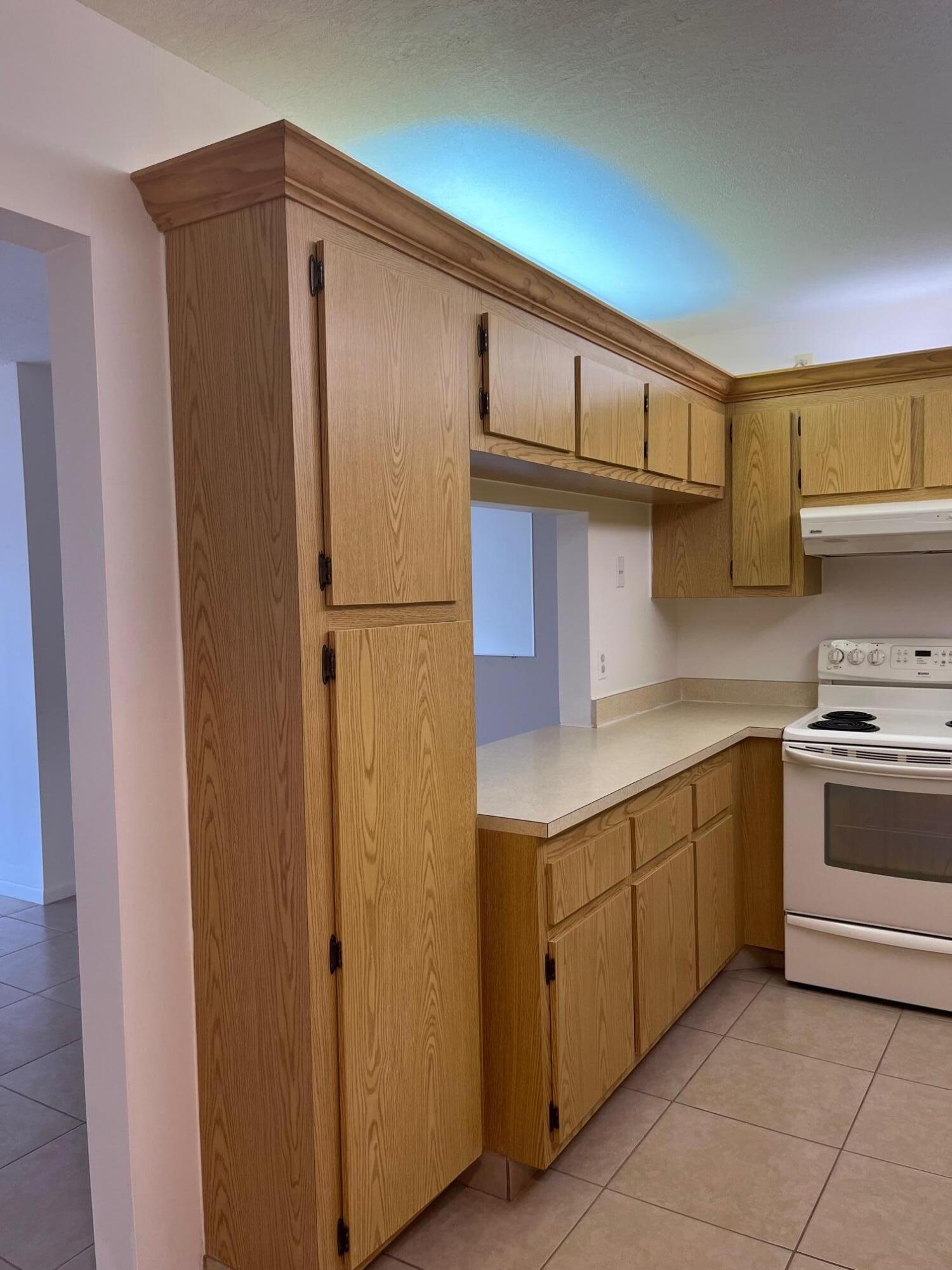 801 Sky Pine Way, Unit B1 Greenacres, FL 33415 - Photo 6 of 17 a kitchen with a sink and a refrigerator