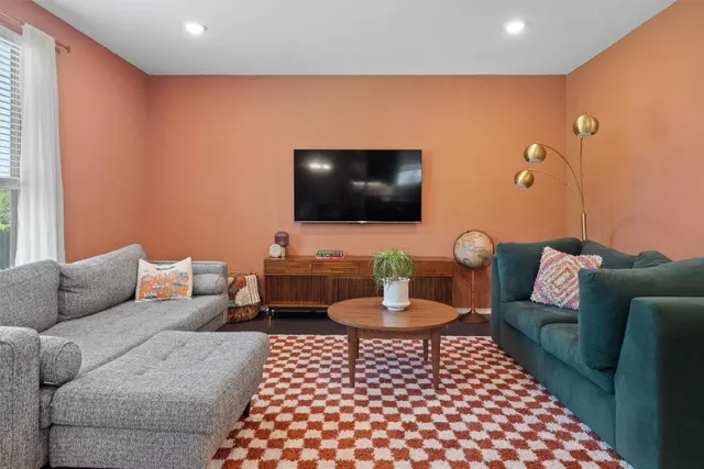 a dining table with chairs and wooden floor