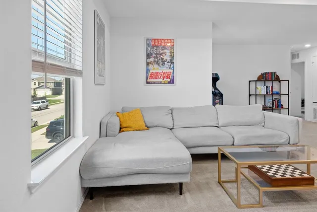 a living room with furniture and a couch