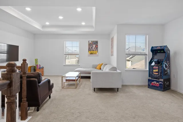 a living room with furniture and a window