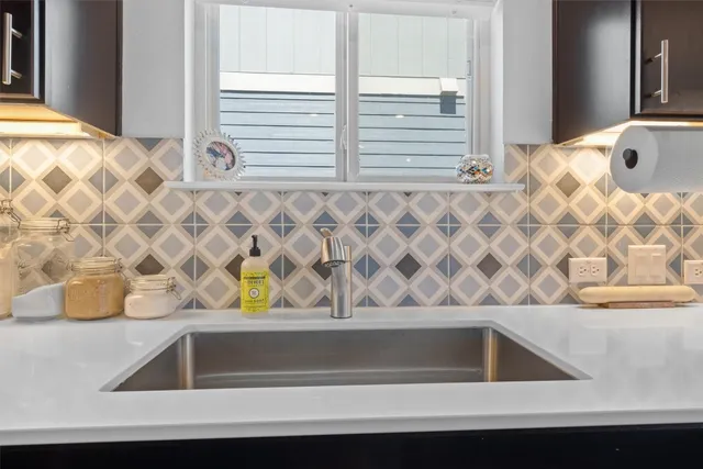 a kitchen with a stove and a refrigerator