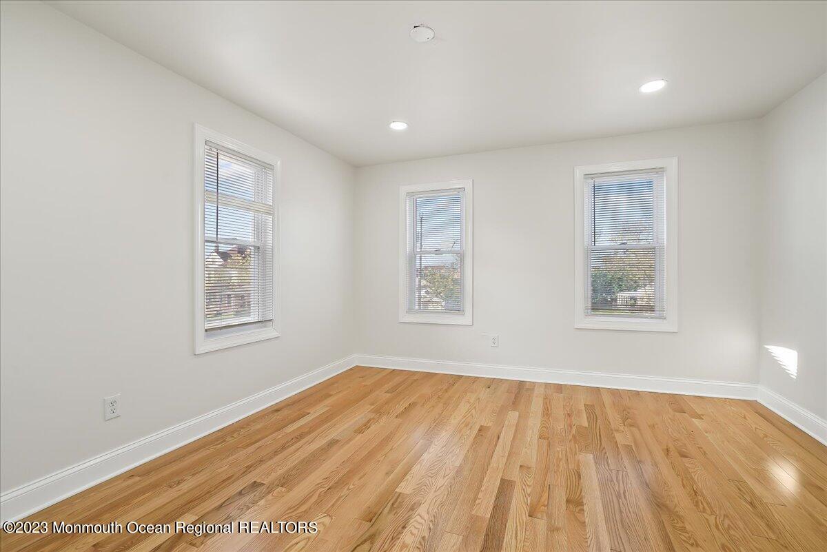 116 11th Avenue, Unit 2 Belmar, NJ 07719 - Photo 20 of 26 a view of empty room with wooden floor and fan