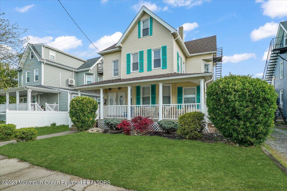 116 11th Avenue, Unit 2 Belmar, NJ 07719 - Photo 2 of 26 a front view of a house with garden