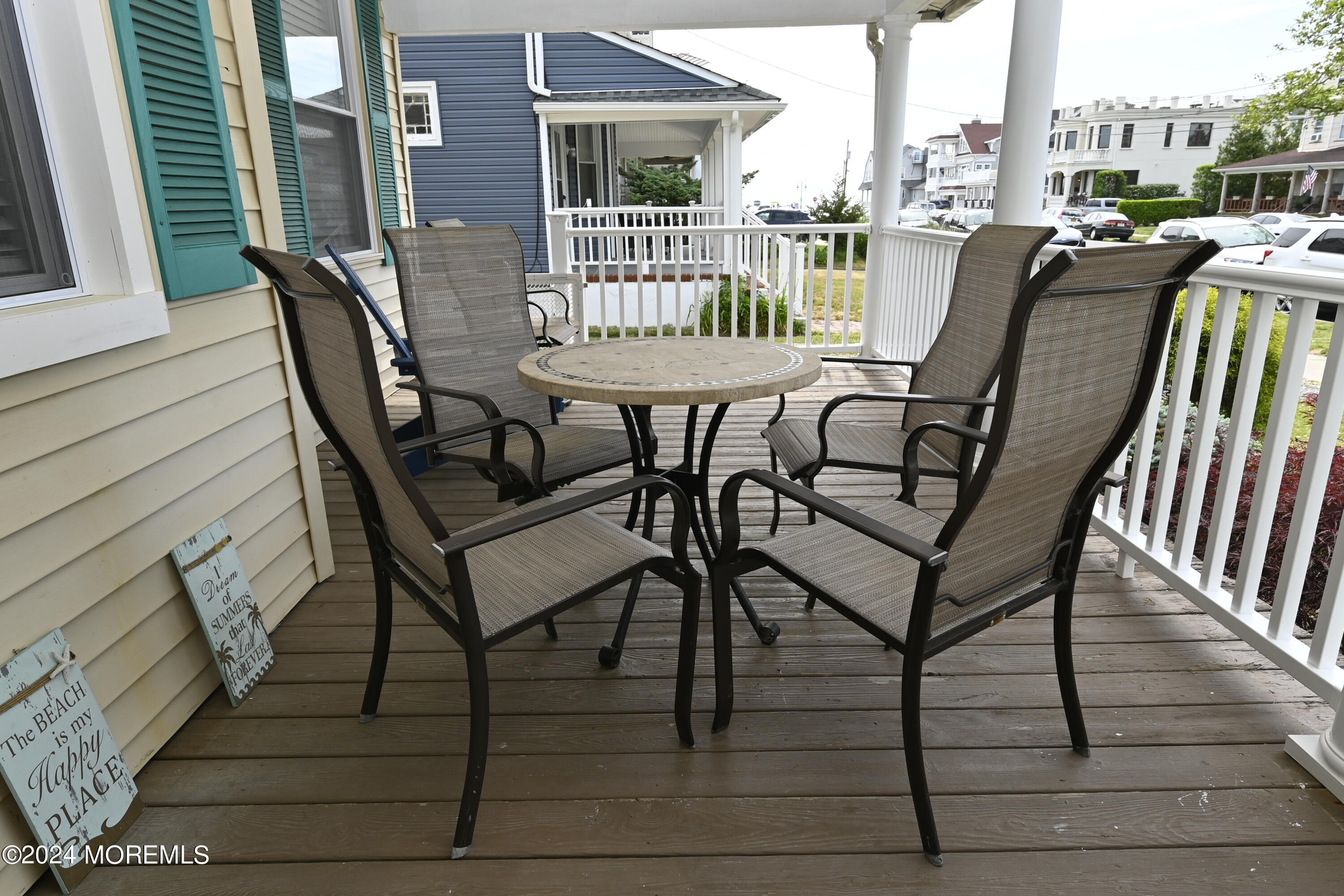 116 11th Avenue, Unit 2 Belmar, NJ 07719 - Photo 26 of 26 a view of a patio with table and chairs
