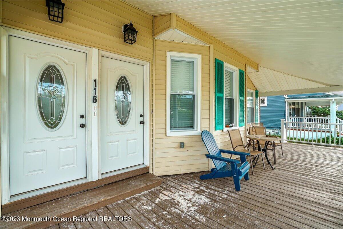 116 11th Avenue, Unit 2 Belmar, NJ 07719 - Photo 6 of 26 a view of a house with porch and wooden floor