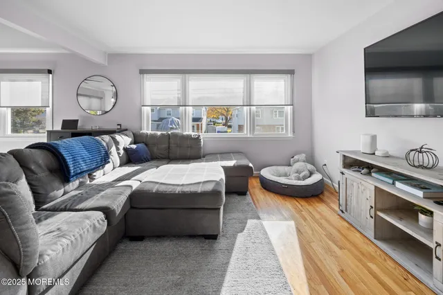 a living room with furniture and a table