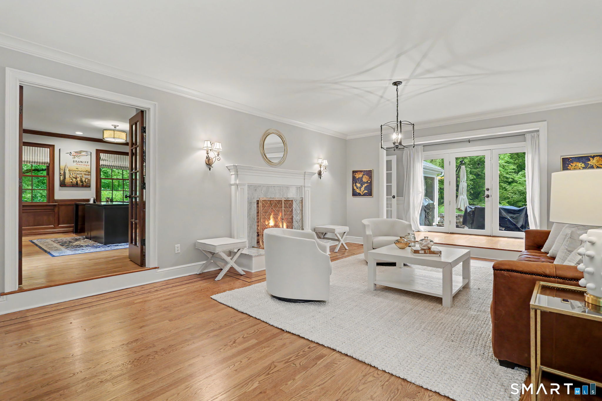 596 Silvermine Road New Canaan, CT 06840 - Photo 3 of 37 Step down elegant living room with French doors to private back yard and office