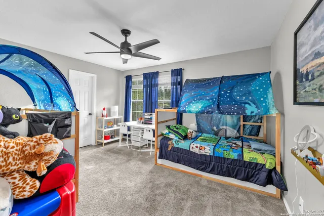 a bedroom with furniture and a bed