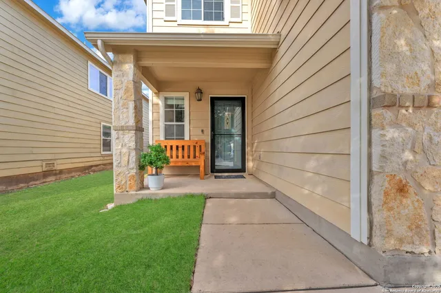 a view of house with backyard