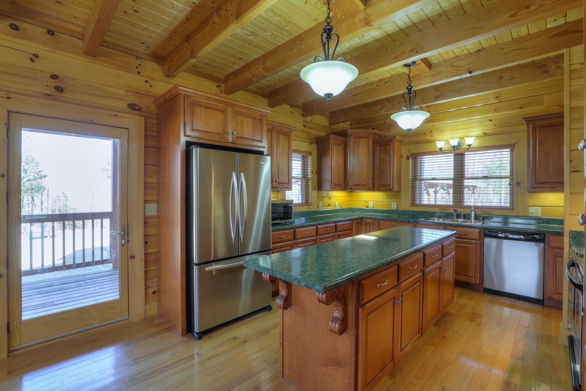2267 Linwood Road Watertown, TN 37184 - Photo 13 of 30 a kitchen with stainless steel appliances granite countertop a sink a stove and a refrigerator