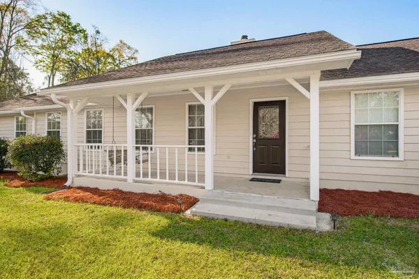 front view of a house with a yard