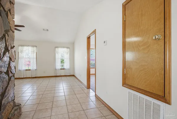 a view of a bathroom from a hallway