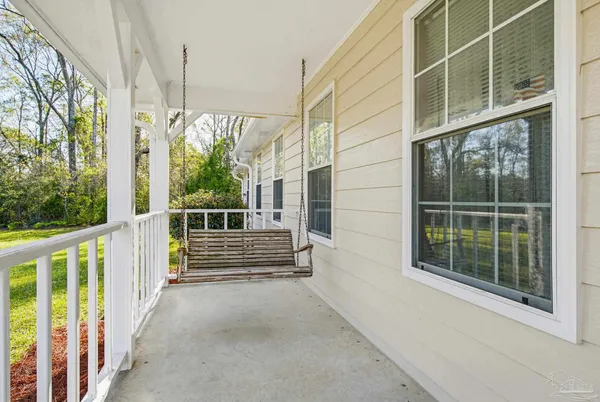 a view of a building with wooden floor and floor to ceiling windows