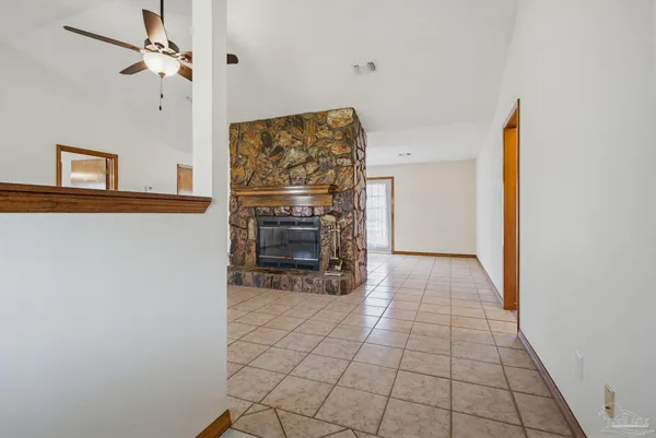 a view of a livingroom with furniture and chandelier