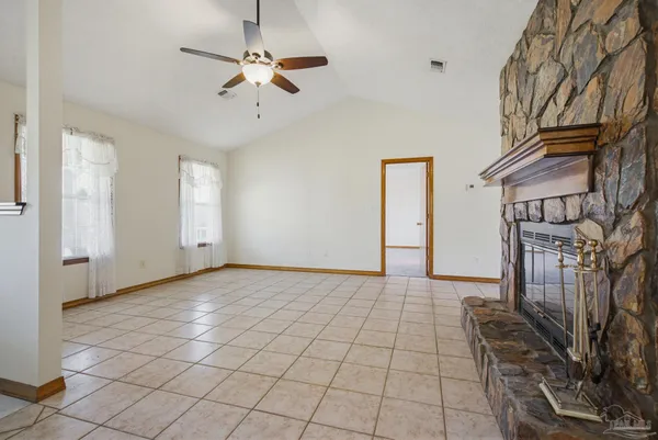a view of a livingroom with a furniture and a ceiling fan
