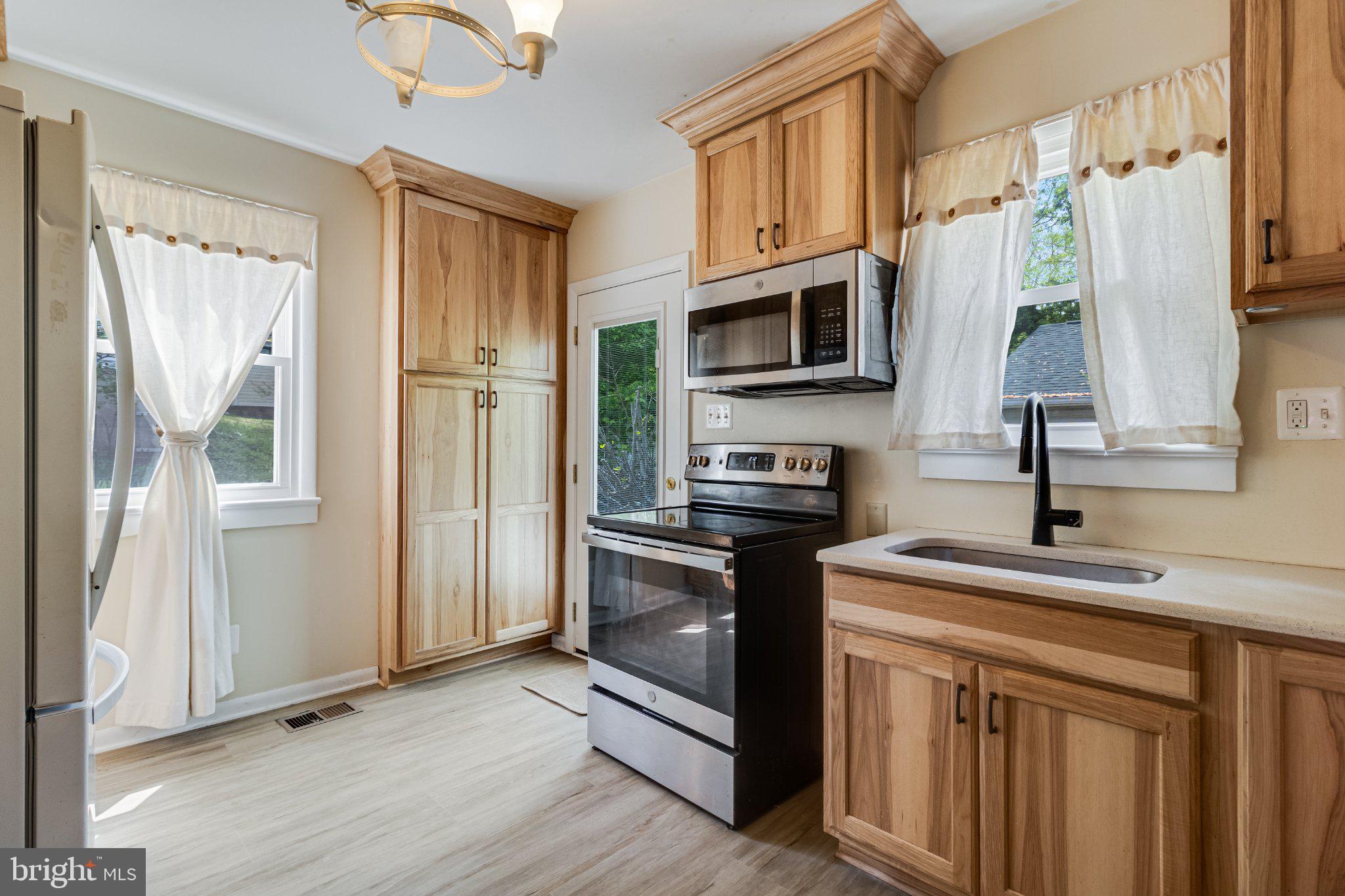 3925 Old Bayside Road Chesapeake Beach, MD 20732 - Photo 3 of 15 Bright and airy kitchen with wood accents.