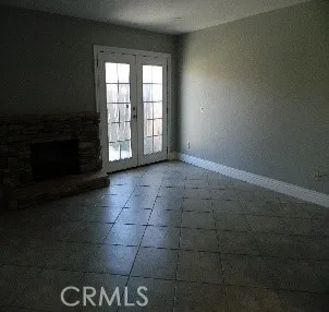 a view of an empty room with a fireplace