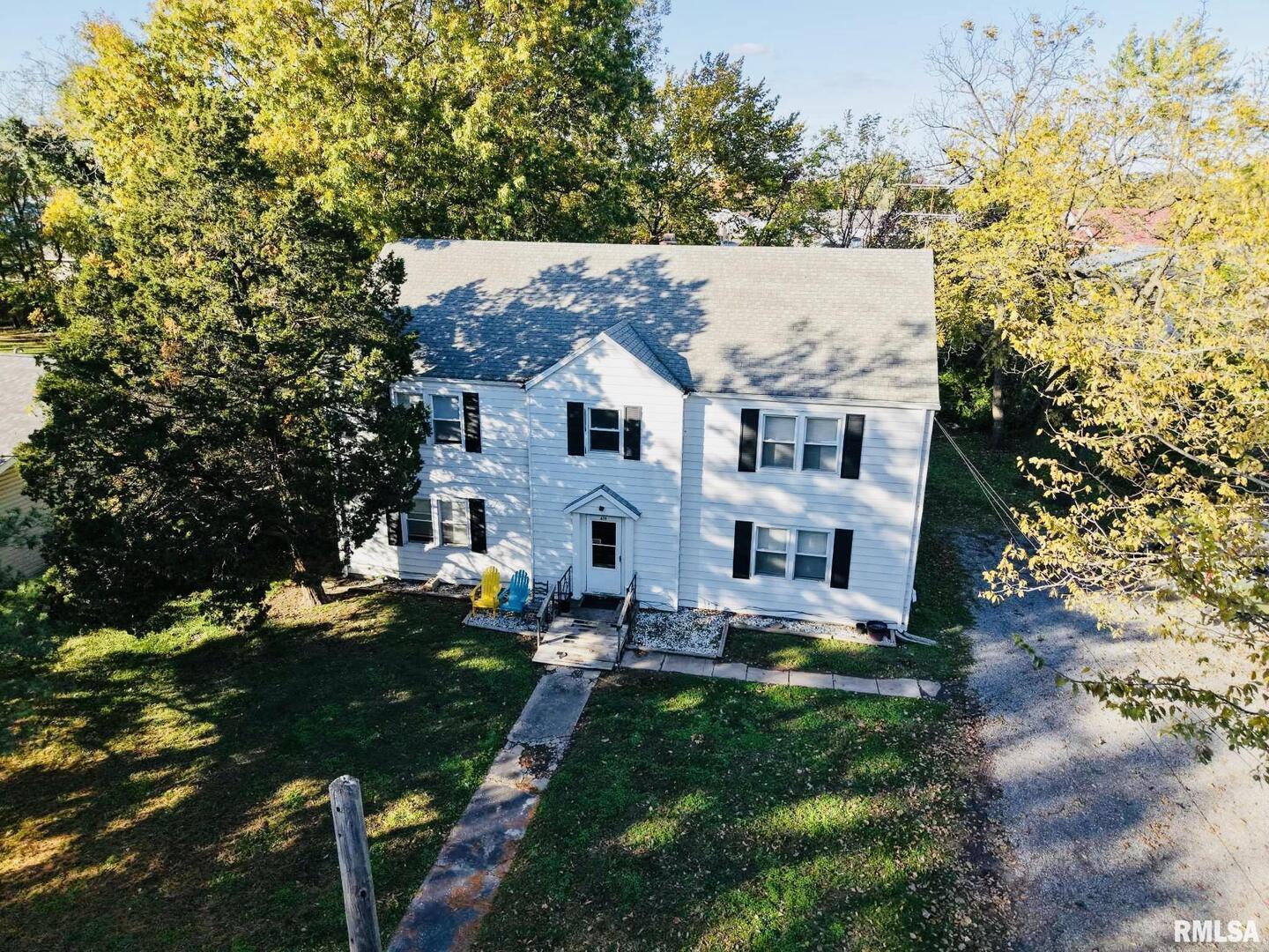 front view of a house with a garden