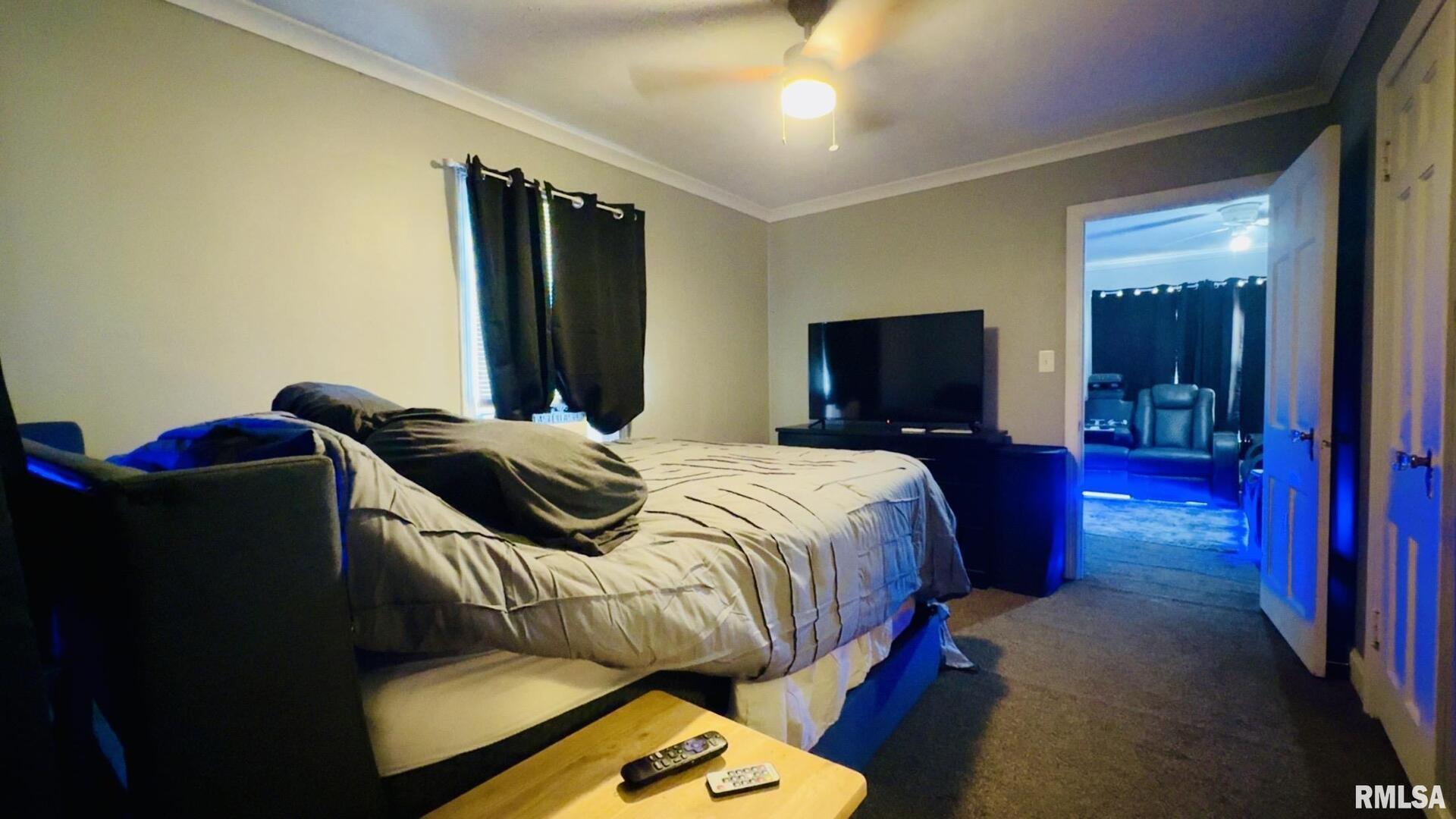 419 East Church Street Benton, IL 62812 - Photo 16 of 16 a bedroom with a bed and a flat screen tv