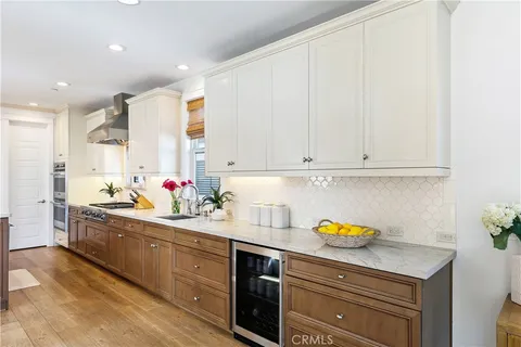 a kitchen with stainless steel appliances kitchen island granite countertop a sink and cabinets
