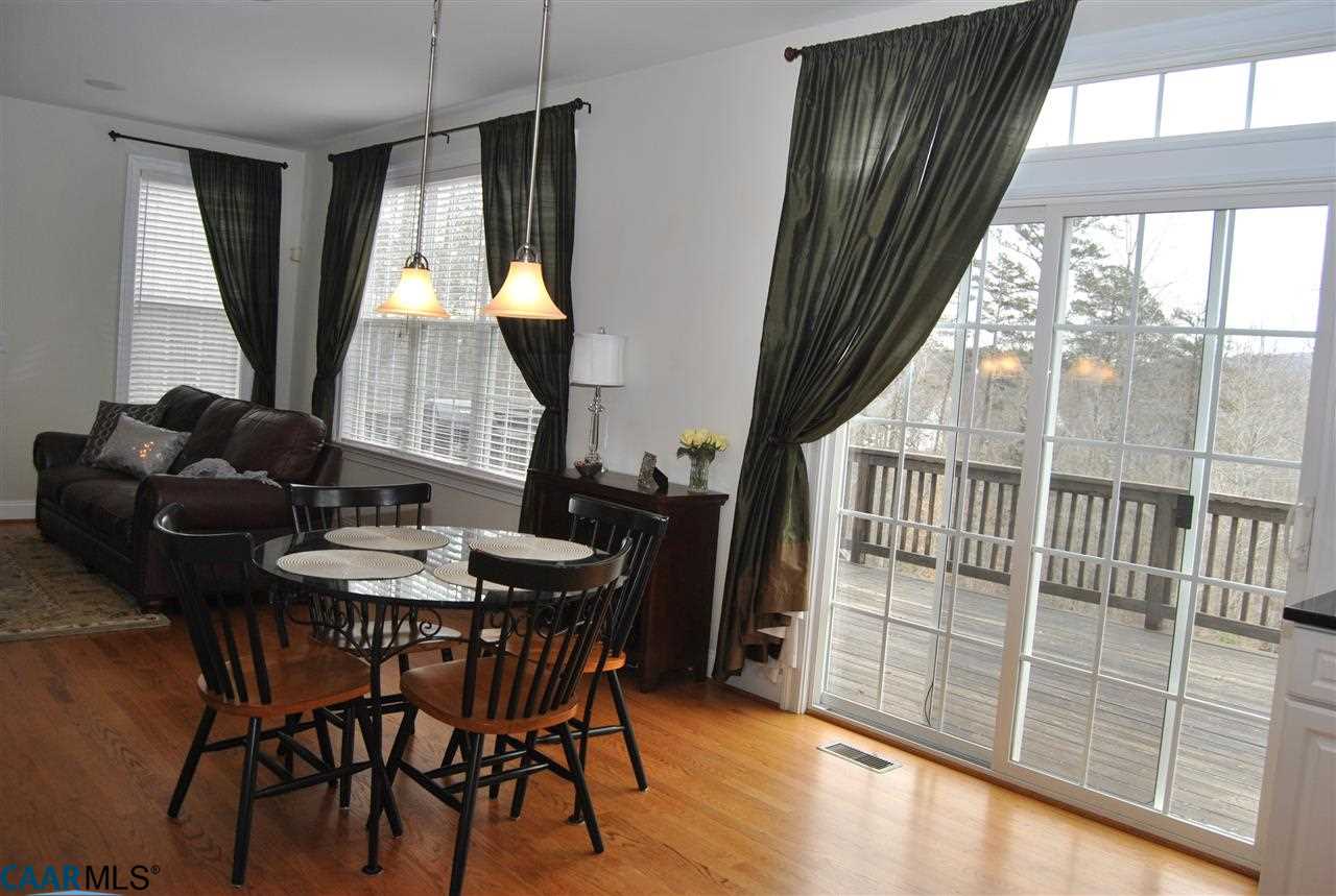 1860 Rhett Court Charlottesville, VA 22903 - Photo 11 of 39 a view of a dining room with furniture and a large window