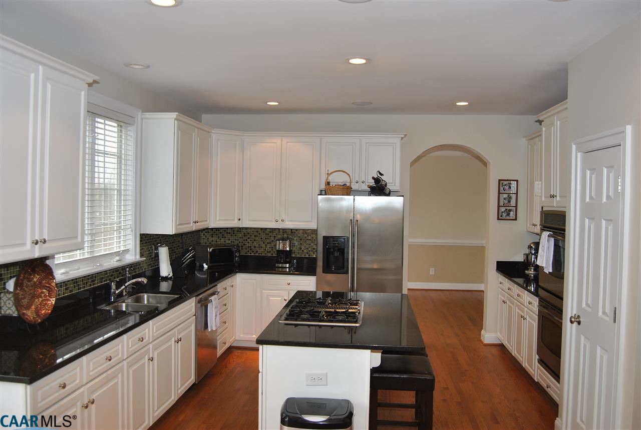 1860 Rhett Court Charlottesville, VA 22903 - Photo 13 of 39 a kitchen with a sink stove and refrigerator