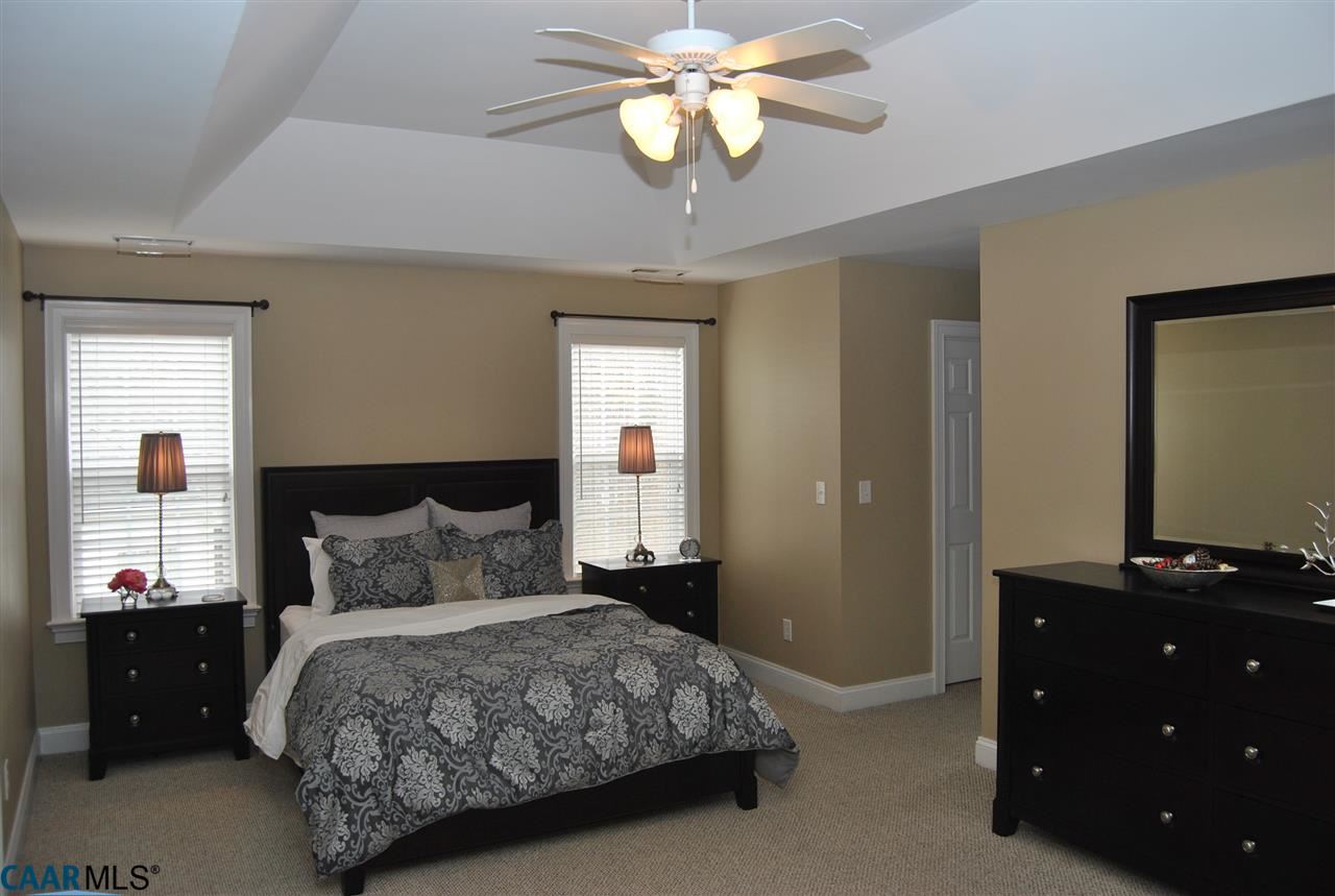 1860 Rhett Court Charlottesville, VA 22903 - Photo 24 of 39 a bedroom with a bed and a chandelier